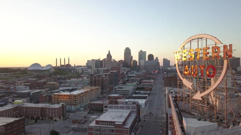Western Auto Sign over Kansas City Skyline in Golden Sunset · Orbit