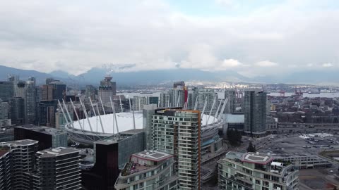 Downtown Vancouver Skyline With BC Place and Mountains · Wide