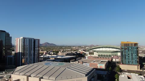 Downtown City Skyline and Desert Mountains