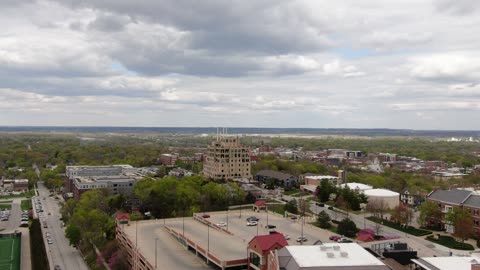 University Campus and Town on an Overcast Day · Flyover