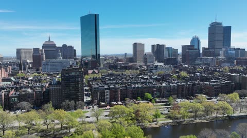 City Skyline Along a River in Spring