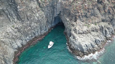 Sea Caves and Turquoise Water by Cliffs