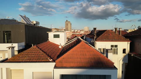Terracotta Rooftops of a Historic European City · Flyover
