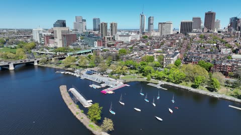 River with Sailboats and a City Skyline