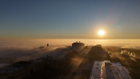 Golden Sunrise Over a Foggy KU Campus