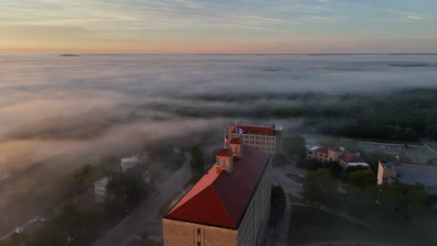 Tilt Down Over Foggy Fraser Hall at Sunrise