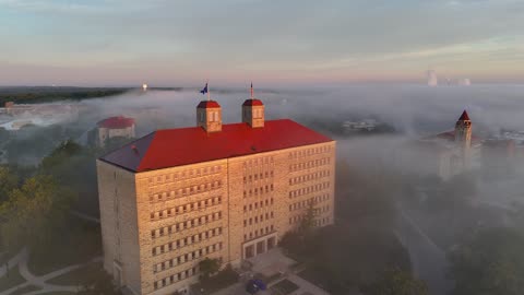Rising Orbit of Fraser Hall Through Sunrise Fog