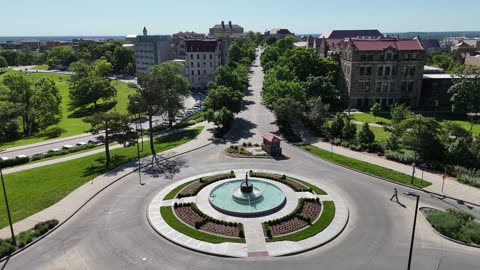 Tilt Down Over Leafy Jayhawk Boulevard in Spring