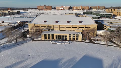 Flyover of the Allen Fieldhouse Rooftop After a Snowfall