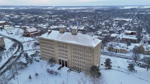 Snow-Covered Fraser Hall at the University of Kansas · Sweeping Pan