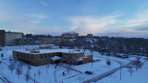 Rising Steam and Fraser Hall on the Snowy KU Campus