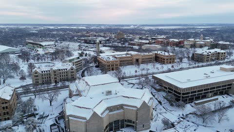 Snowy KU Campus and Lawrence Skyline · Wide