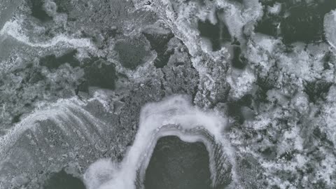 Icy Kansas River Beside Downtown Lawrence · Sweeping Pan