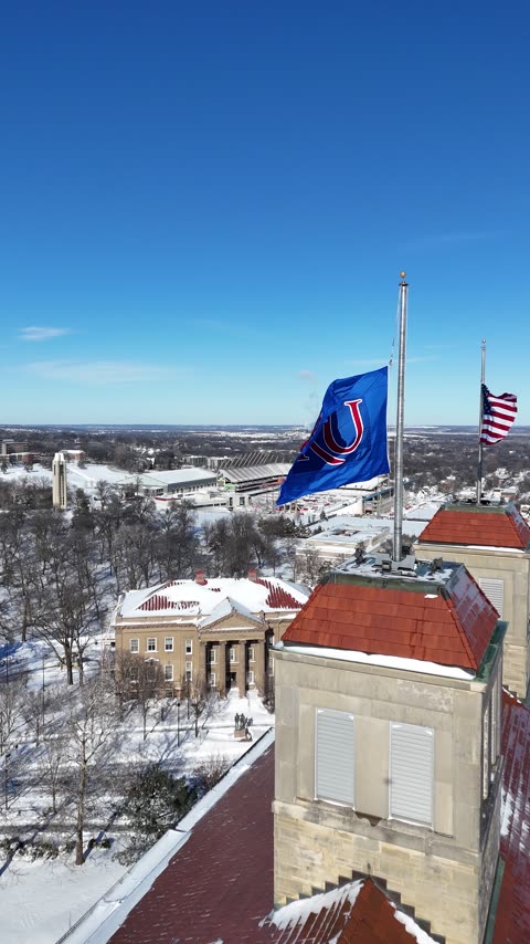 Pan Past the Flags and Towers of Snowy Fraser Hall