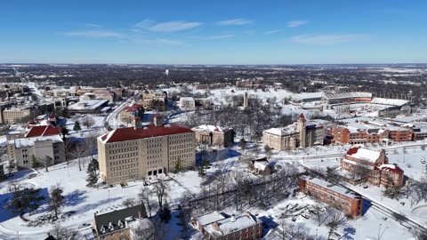 Fraser Hall Over the Snowy Lawrence Skyline · Wide