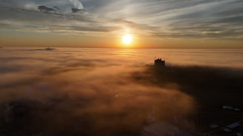 Beneath the Fog at Golden Sunrise · Low Flight