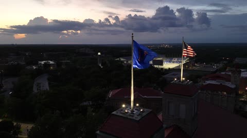 Fraser Hall and Its Flags on a Summer Evening