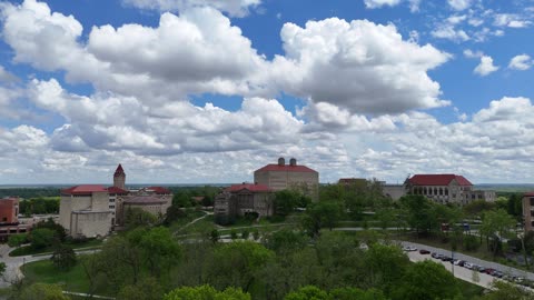 Tilt Up Fraser Hall Into Drifting Spring Clouds