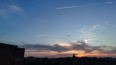 Plane Contrail Over the KU Campus at Sunset