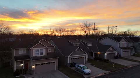 Tilt Up to Sunrise Over a Quiet Neighborhood