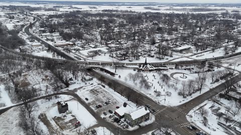 View of a Train Crossing a Snow-Covered Landscape